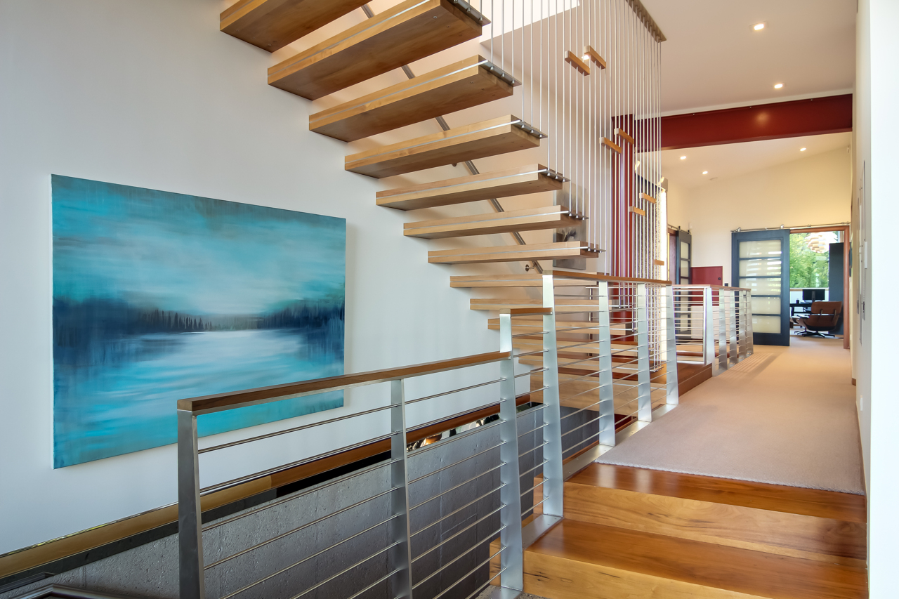 Suspended black walnut staircase